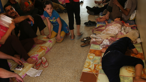 Displaced Iraqi Christians sleep inside of Saint Joseph's church after having to flee their district on June 26, 2014 in Erbil, Iraq. (Spencer Platt/Getty Images)