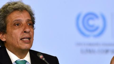 COP20 President and Peruvian Minister of Environment Manuel Pulgar slams his mallet on December 14, 2014, during the marathon UN talks in Lima. (CRIS BOURONCLE/AFP/Getty Images)