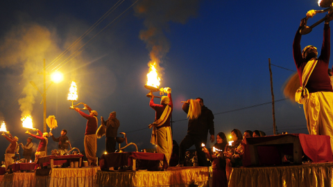 Indian Hindu priests perform an evening prayer ritual known as Arti at the Sangam, the confluence of the holy rivers Ganges and Yamuna and mythical Saraswati, during the annual Magh Mela in Allahabad on January 5, 2015. (Sanjay Kanojia/AFP/Getty Images)