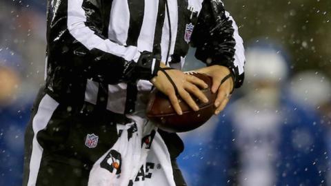 Umpire Carl Paganelli #124 holds a ball on the field after a play during the 2015 AFC Championship Game between the New England Patriots and the Indianapolis Colts at Gillette Stadium on January 18, 2015 in Foxboro, Massachusetts. (Elsa/Getty Images)
