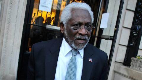 Raymond Joseph stands outside the Haitian embassy in Washington, DC, on January 19, 2010, following a candle light vigil one week after a massive earthquake destroyed Port-au-Prince. (Alex Ogle/AFP/Getty Images)