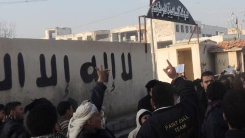 People demonstrate outside the offices of the Al-Qaeda-linked Islamic State of Iraq and the Levant (ISIL) on January 6, 2014 in the northern Syrian city of Aleppo. (MOHAMMED WESAM/AFP/Getty Images)