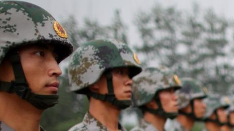 People's Liberation Army (PLA) soldiers during a reporting trip to the Third Guard Division of the PLA on July 28, 2009 in Beijing, China. (Feng Li/Getty Images)