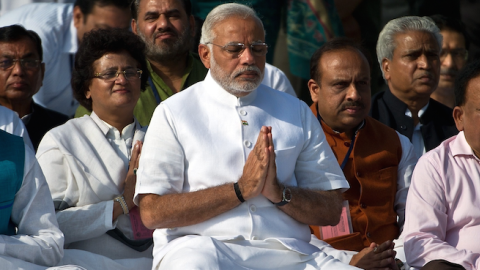 India Prime Minister Narendra Modi (C) pays tributes at Rajghat, memorial of Mahatama Gandhi in New Delhi on May 26, 2014.(PRAKASH SINGH/AFP/Getty Images)