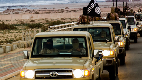 An image made available by propaganda Islamist media outlet Welayat Tarablos on February 18, allegedly shows members of the Islamic State militant group parading in a street in Libya's coastal city of Sirte.  (AGENCE FRANCE-PRESSE/GETTY IMAGES)