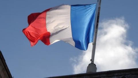The French flag flies at half mast at the Elysee Palace during a Unity rally Marche Republicaine on January 11, 2015 in Paris. (DOMINIQUE FAGET/AFP/Getty Images)