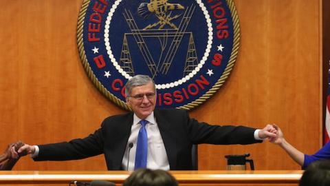 FCC Chairman Tom Wheeler (C) holds hands with FCC Commissioners Mignon Clyburn (L) and Jessica Rosenworcel during an open hearing on Net Neutrality at the FCC headquarters February 26, 2015 in Washington, DC. (Mark Wilson/Getty Images)