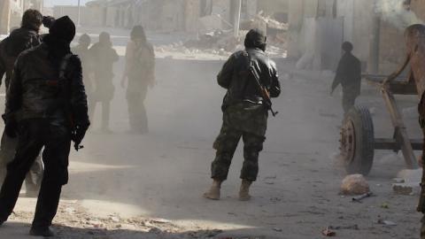 Members of the jihadist group Al-Nusra Front fire homemade mortar rounds during fighting with government forces on February 8, 2014 in the Syrian village of Aziza, on the southern outskirts of Aleppo. (BARAA AL-HALABI/AFP/Getty Images)