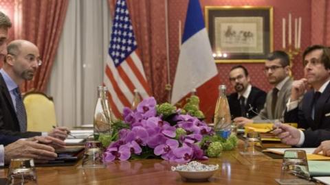 US Secretary of State John Kerry (L) and French Foreign Minister Laurent Fabius (R) talk before a meeting at the Beau Rivage Palace Hotel March 28, 2015 in Lausanne. (BRENDAN SMIALOWSKI/AFP/Getty Images)
