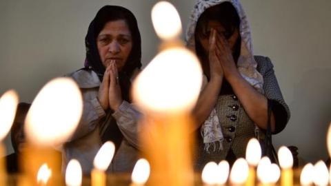 Women attend a religious service at the cathedral in Etchmiadzin, outside Yerevan, on April 23, 2015. (KIRILL KUDRYAVTSEV/AFP/Getty Images)