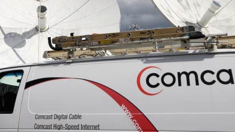 A Comcast truck is seen parked at one of their centers on February 13, 2014 in Pompano Beach, Florida. (Joe Raedle/Getty Images)