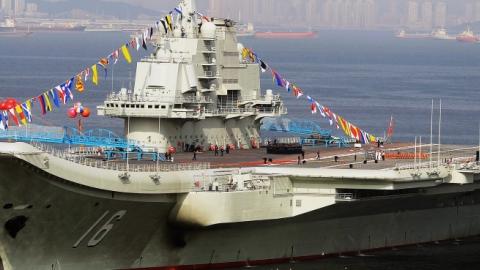 China's first aircraft carrier, a former Soviet carrier called the Varyag, docked after its handover to the People's Liberation Army (PLA) navy in Dalian, northeast China's Liaoning province, September 24, 2012. (STR/AFP/Getty Images)