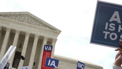 People celebrate in front of the US Supreme Court after ruling was announced on the Affordable Care Act. June 25, 2015 in Washington, DC. (Mark Wilson/Getty Images)