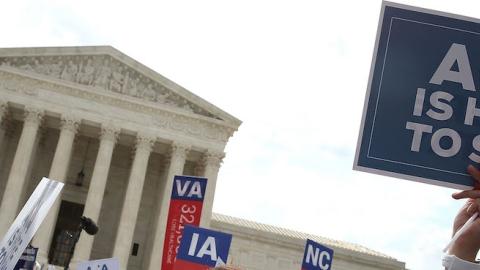 People celebrate in front of the US Supreme Court after ruling was announced on the Affordable Care Act. June 25, 2015 in Washington, DC. (Mark Wilson/Getty Images)