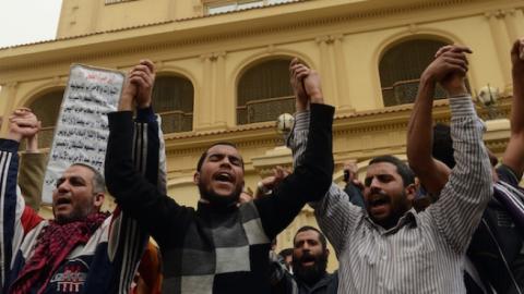 Members of the Egyptian Muslim brotherhood gather in front the party's headquarters in Cairo on March 22, 2013. (KHALED DESOUKI/AFP/Getty Images)