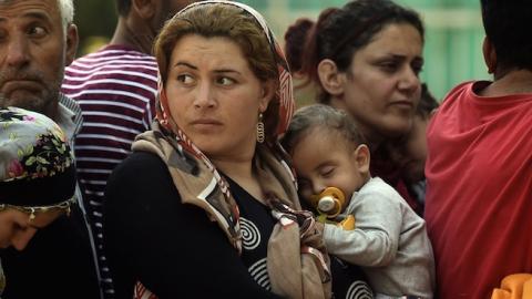 Syrian refugees at a registration camp in Presevo after their arrival in Serbia on August 30, 2015. (ARIS MESSINIS/AFP/Getty Images)