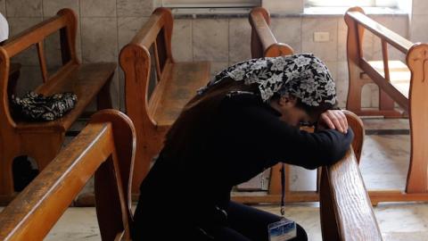 Displaced Assyrians take part in a prayer at the Ibrahim-al Khalil Melkite Greek Catholic church on the outskirts of the capital Damascus on March 1, 2015. (LOUAI BESHARA/AFP/Getty Images)