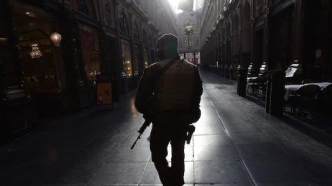 A soldier patrols in an empty shopping galery as the Belgian capital remains on the highest possible alert level, in Brussels on November 23, 2015. (EMMANUEL DUNAND/AFP/Getty Images)