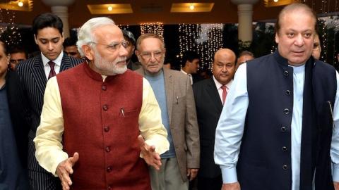 Prime Minister of Pakistan Nawaz Sharif (R) welcomes Indian Prime Minister Narendra Modi (L) at Allama Iqbal International Airport in Lahore, Pakistan on December 25, 2015. (Indian Press Information office/Anadolu Agency/Getty Images)