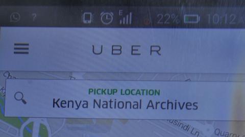 A non-licensed private cab driver working with Uber shows a Uber mobile application in Nairobi on February 4, 2016. (SIMON MAINA/AFP/Getty Images)