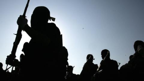 Masked Palestinian members of the Islamic Jihad military wing Saraya Al-Quds march in remembrance of its founder Fathi Shiqaqi on October 24, 2008 in Khan Younis, the Gaza Strip. (Abid Katib/Getty Images)