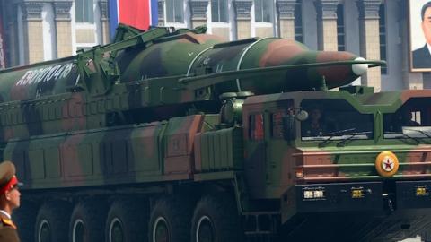 A launcher carrying what analysts have said is a mock-up of the KN-08 ICBM moves through Pyongyang on April 15, 2012, as part of a military parade. (Pedro Ugarte/AFP/Getty Images)