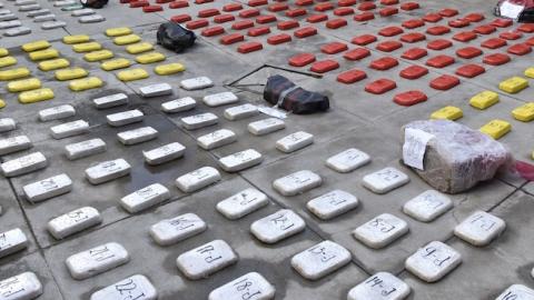 Bolivia's Interior Minister Carlos Romero (R) presents drug seized in La Paz, on September 4, 2015. (Aizar Raldes Nunez/AFP/Getty Images)