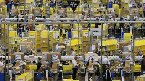 Parcels are prepared for dispatch at Amazon's warehouse on December 5, 2014 in Hemel Hempstead, England. (Peter Macdiarmid/Getty Images)