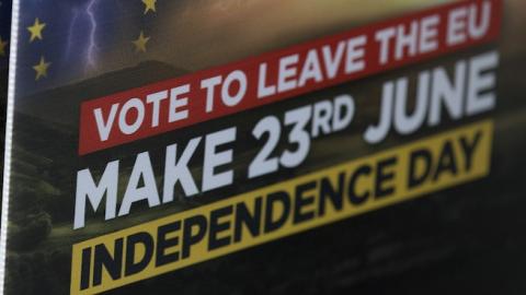 A Leave campaigner holds placards in Clacton-on-Sea, eastern England on June 21, 2016. (JUSTIN TALLIS/AFP/Getty Images)