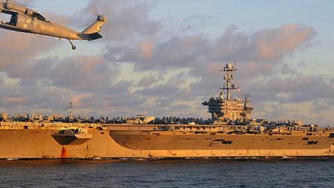 The Nimitz-class aircraft carrier USS George Washington (CVN 73) conducts a vertical replenishment at sea in the U.S. 7th Fleet area of responsibility, South China Sea, July 8, 2012. (U.S. Navy/Mass Communication Specialist Seaman Declan Barnes/Released)