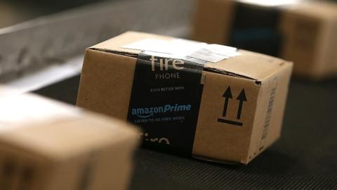 Boxes move along a conveyor belt at an Amazon fulfillment center on January 20, 2015 in Tracy, California. (Justin Sullivan/Getty Images)