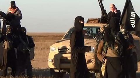 Screenshot from a propaganda video uploaded on June 11 by the Islamic State allegedly shows militants driving at an undisclosed location in Iraq's Nineveh province.