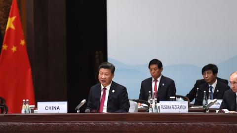 China's President Xi Jinping (C) flanked by US President Barack Obama (L) and Russia's President Vladimir Putin (R) during the opening ceremony of the G20 Summit in Hangzhou on September 4, 2016. (STEPHANE DE SAKUTIN/AFP/Getty Images)