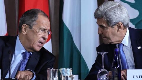 Russia's Foreign Minister Sergei Lavrov (L) and US Secretary of State John Kerry talking during an International Syria Support Group meeting at the Lotte New York Palace Hotel. (Valery Sharifulin\TASS via Getty Images)
