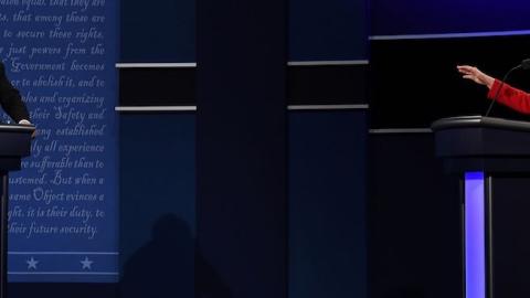 Republican nominee Donald Trump (L) speaks as Democratic nominee Hillary Clinton gestures on during the first presidential debate at Hofstra University in Hempstead, New York on September 26, 2016. (JEWEL SAMAD/AFP/Getty Images)