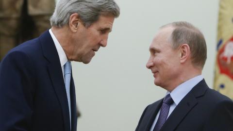 Russian President Vladimir Putin (R) shakes hands with US Secretary of State John Kerry during a meeting at the Kremlin in Moscow on December 15, 2015. (SERGEI KARPUKHIN/AFP/Getty Images)