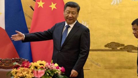 Philippines' President Rodrigo Duterte (R) by his Chinese counterpart Xi Jinping before a signing ceremony in Beijing on October 20, 2016. (NG HAN GUAN/AFP/Getty Images)