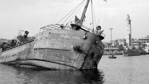 A ship sunk by Egyptians to block the Suez Canal appears at the surface of water, November 11, 1956 in Port SaÃ¯d. (STAFF/AFP/Getty Images)