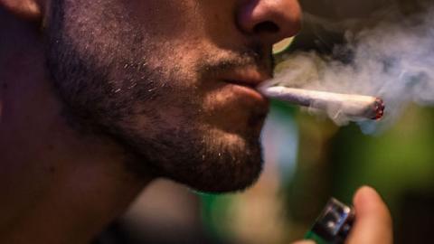 A man smokes a marijuana joint in a cannabis club on August 22, 2014 in Barcelona, Spain. (David Ramos/Getty Images)