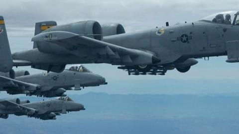 Three A-10 Thunderbolt II aircraft fly in formation over Tucson, Ariz., during an air refueling training mission, April 14, 2006. (Senior Airman Christina D. Ponte/DefenseLINK/Released)