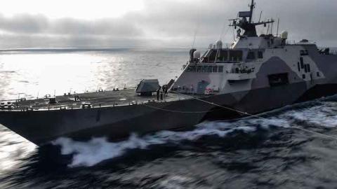 The littoral combat ship USS Freedom (LCS 1) pulls alongside USS John C. Stennis (CVN 74) off the coast of Southern California, April 28, 2015. (U.S. Navy Photo by Mass Communication Specialist 3rd Class Ignacio D. Perez/ Released)