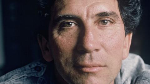 Reinaldo Arenas poses while at home in Paris, France during June of 1988. (Ulf Andersen/Getty Images)