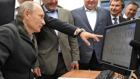 Russian Prime Minister Vladimir Putin (L),Gazprom CEO Alexei Miller (2nd L) and former German chancellor Gerhard Schroeder (3rd L) at the gas compressor station 'Portovaya' outside Vyborg, September 6, 2011. (ALEXEY NIKOLSKY/AFP/Getty Images)