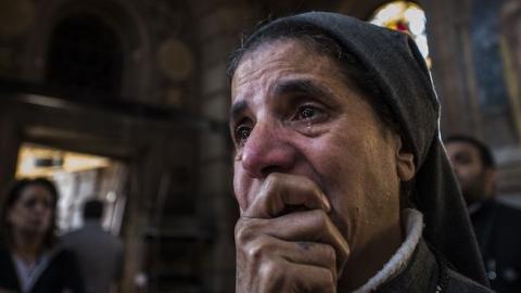 A nun reacts to the scene of a bomb explosion at the Saint Peter and Saint Paul Coptic Orthodox Church on December 11, 2016, in Cairo's Abbasiya neighbourhood. (KHALED DESOUKI/AFP/Getty Images)