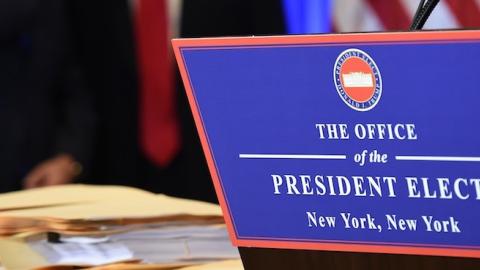 Vice President-elect Mike Pence and President-elect Donald Trump talk during Trump's press conference at Trump Tower in New York on January 11, 2017. (TIMOTHY A. CLARY/AFP/Getty Images)