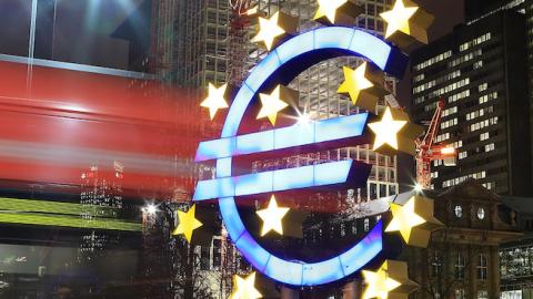 A tram passes the giant Euro symbol outside the headquarters of the European Central Bank (ECB) on January 8, 2013 in Frankfurt am Main, Germany. (Hannelore Foerster/Getty Images)