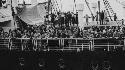 Refugees arrive in Antwerp on the MS St. Louis after over a month at sea, during which they were denied entry to Cuba, the U.S. and Canada, June 17, 1939. (Three Lions/Hulton Archive/Getty Images)