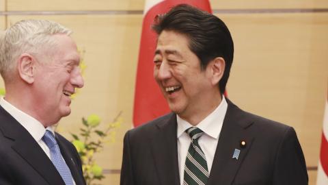 US Defense Secretary James Mattis (L) and Japanese Prime Minister Shinzo Abe (R) shake hands at the prime minister's office in Tokyo on February 3, 2017. (EUGENE HOSHIKO/AFP/Getty Images)