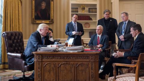 President Donald Trump speaks on the phone with Russian President Vladimir Putin in the Oval Office of the White House, January 28, 2017 in Washington, DC. (Drew Angerer/Getty Images)