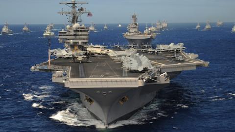 The Nimitz-class aircraft carrier USS Ronald Reagan (CVN 76) leads a mass formation of ships through the Pacific Ocean July 24, 2010, during Rim of the Pacific (RIMPAC) 2010. (Mass Communication Specialist 1st Class Scott Taylor, U.S. Navy/Released)